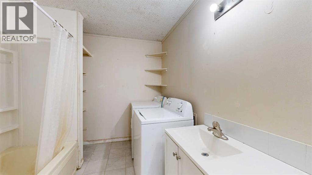 10806 102 Street, Grande Prairie, AB - Indoor Photo Showing Laundry Room