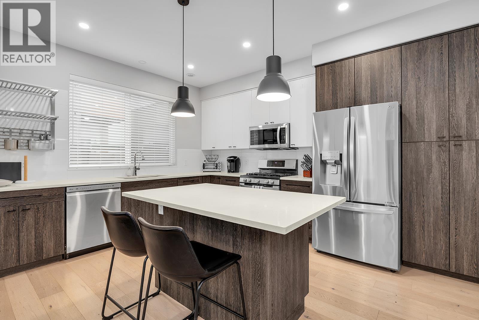 Kitchen. Photos are from Previous Listing - 1927 Ethel Street, Kelowna, BC - Indoor Photo Showing Kitchen With Stainless Steel Kitchen With Upgraded Kitchen