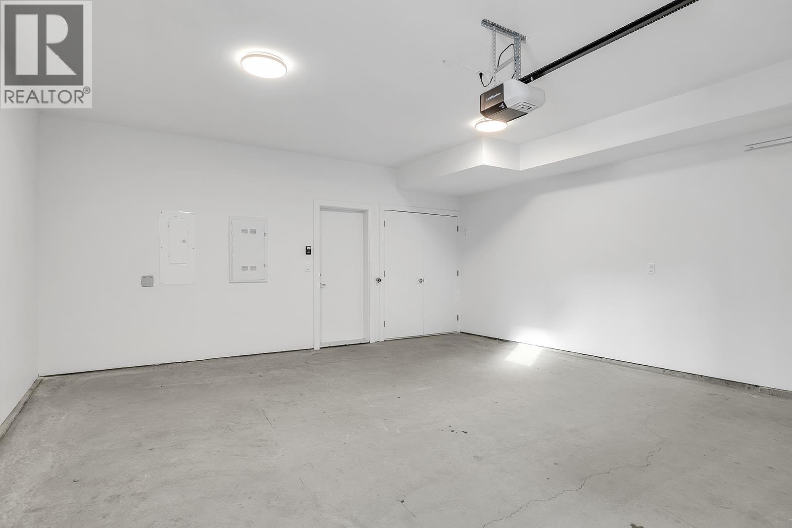 Photos are of a similar home in the community. - 5300 Main Street Unit# 115, Kelowna, BC - Indoor Photo Showing Garage