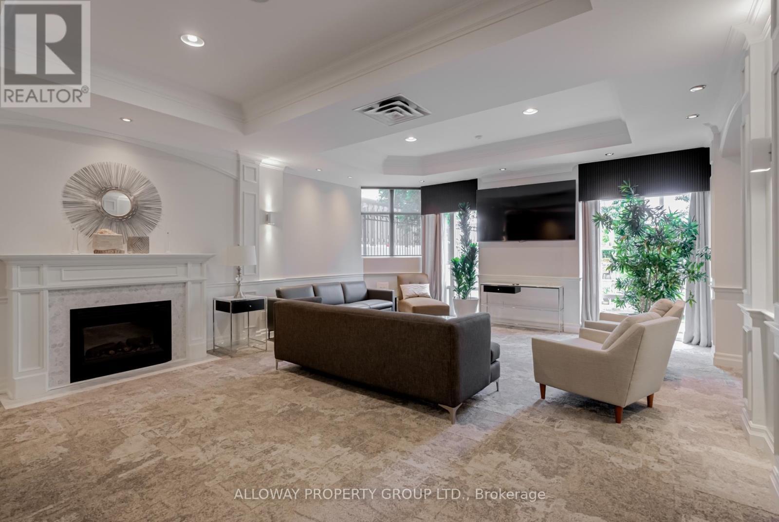 103 - 130 Pond Drive, Markham, ON - Indoor Photo Showing Living Room With Fireplace