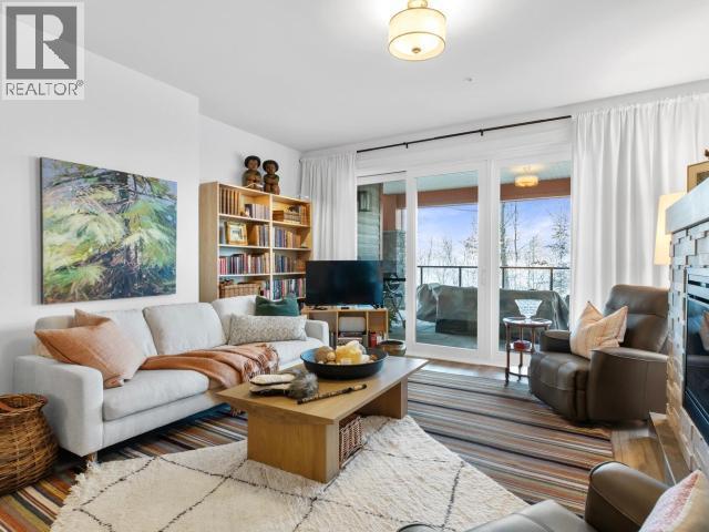 104-36 Waterfront Place, Whitehorse, YT - Indoor Photo Showing Living Room With Fireplace