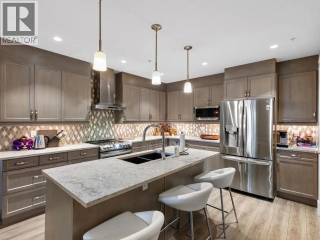 104-36 Waterfront Place, Whitehorse, YT - Indoor Photo Showing Kitchen With Stainless Steel Kitchen With Double Sink With Upgraded Kitchen