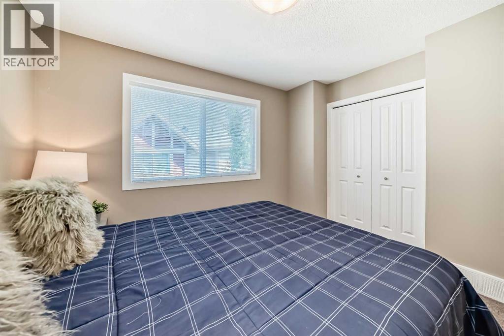 236 New Brighton Row Se, Calgary, AB - Indoor Photo Showing Bedroom