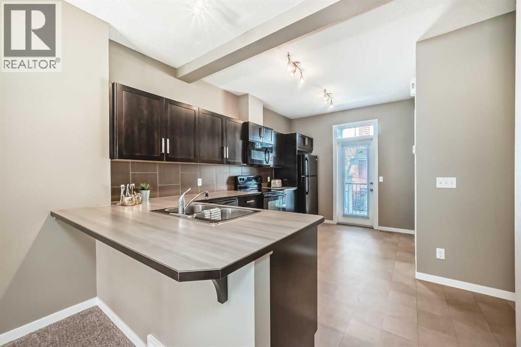 236 New Brighton Row Se, Calgary, AB - Indoor Photo Showing Kitchen With Double Sink