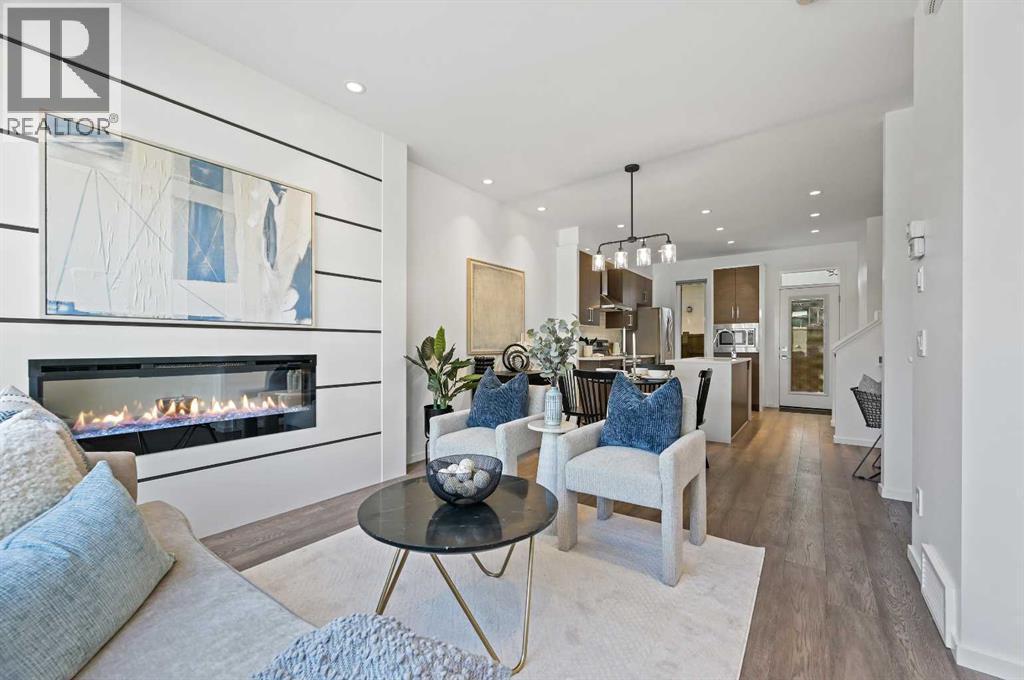 3569 19 Avenue Sw, Calgary, AB - Indoor Photo Showing Living Room With Fireplace