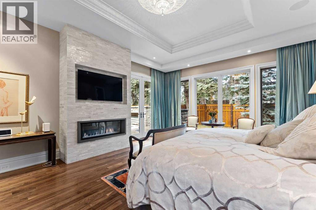 1020 Bel-Aire Drive, Calgary, AB - Indoor Photo Showing Bedroom With Fireplace