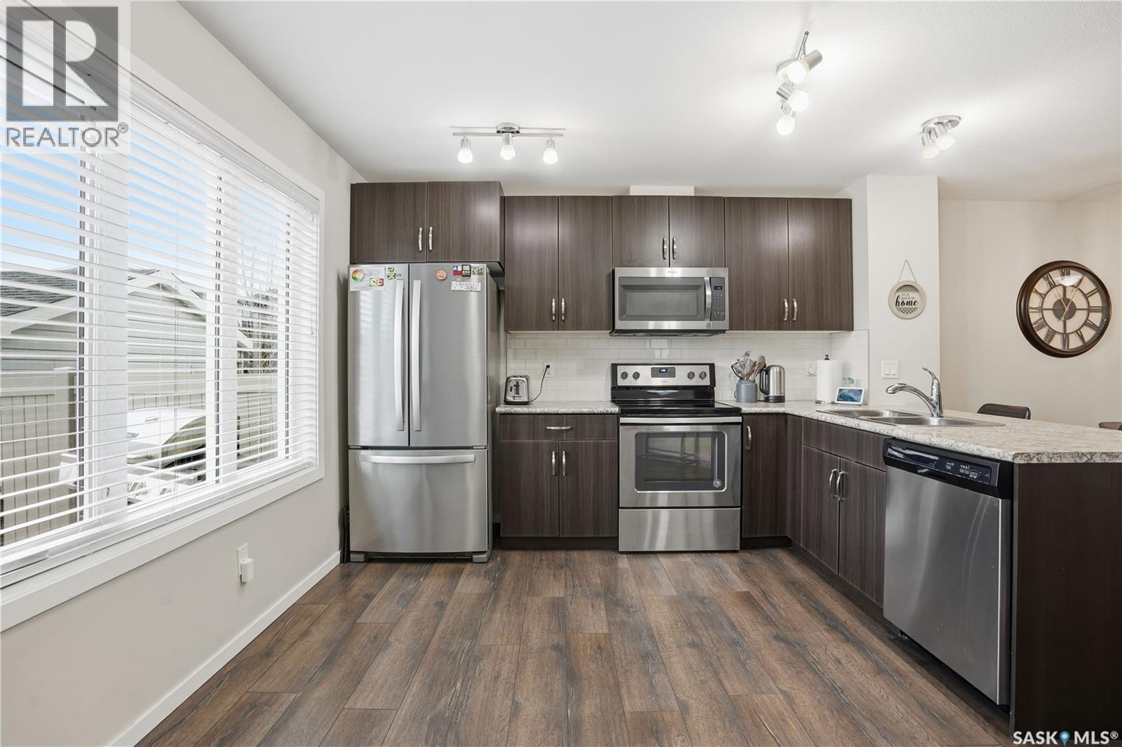 7904 Canola Avenue, Regina, SK - Indoor Photo Showing Kitchen With Double Sink