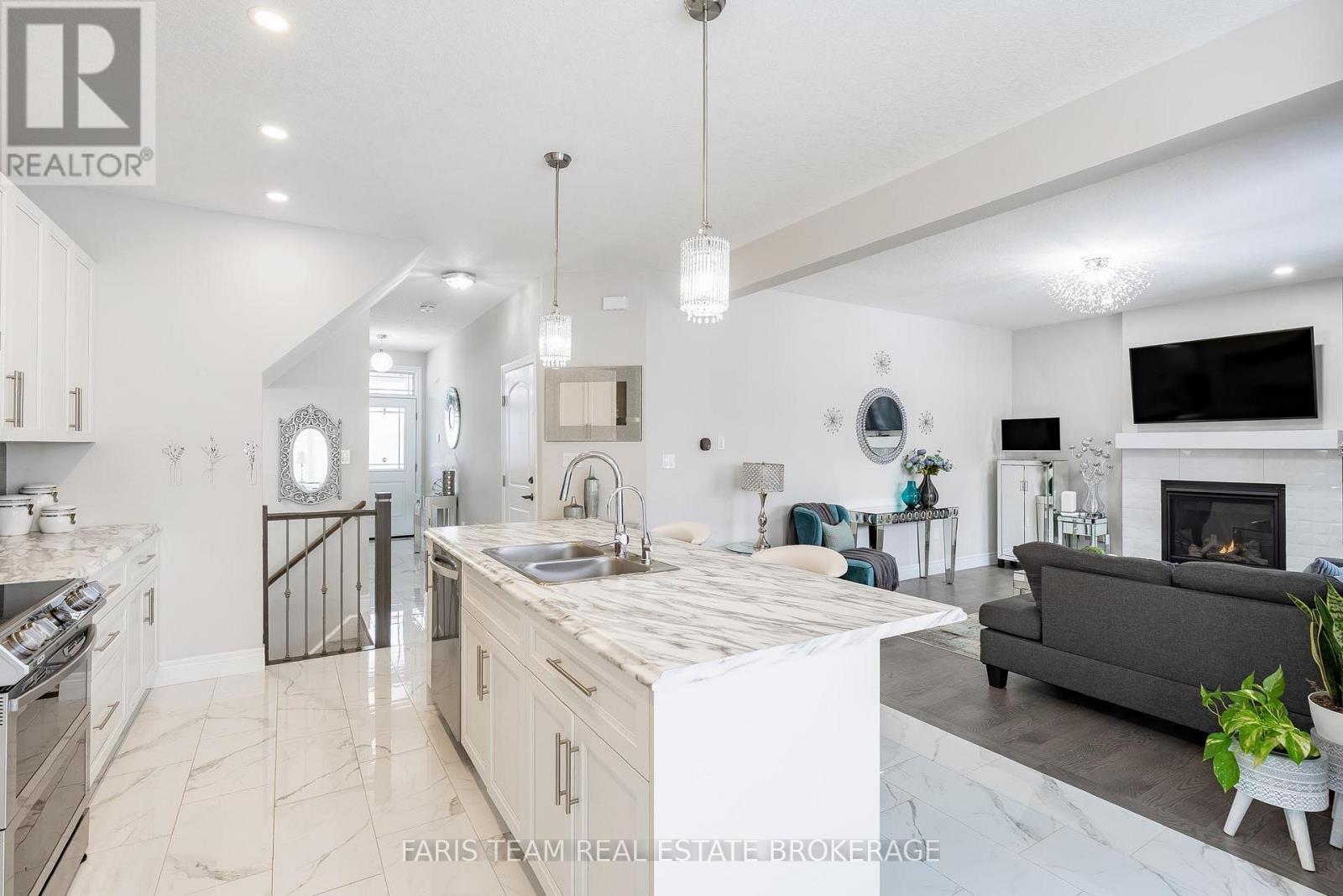 13 Tindall Crescent, East Luther Grand Valley, ON - Indoor Photo Showing Kitchen With Fireplace With Double Sink With Upgraded Kitchen