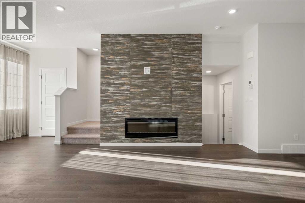 110 Wolf Creek Rise Se, Calgary, AB - Indoor With Fireplace