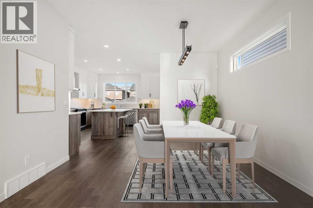 This photo has been virtually staged - 110 Wolf Creek Rise Se, Calgary, AB - Indoor Photo Showing Dining Room