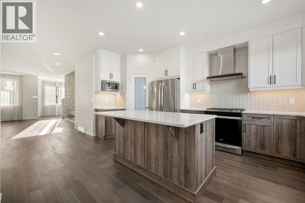 110 Wolf Creek Rise Se, Calgary, AB - Indoor Photo Showing Kitchen With Upgraded Kitchen