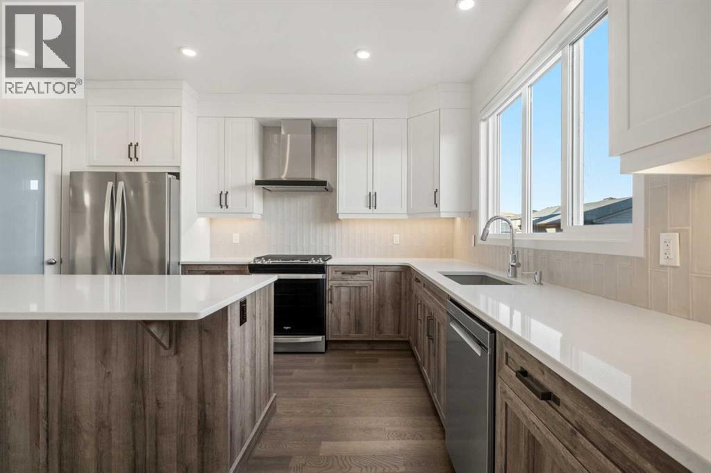 110 Wolf Creek Rise Se, Calgary, AB - Indoor Photo Showing Kitchen With Upgraded Kitchen