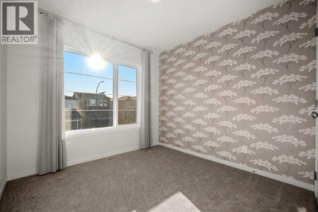 110 Wolf Creek Rise Se, Calgary, AB - Indoor Photo Showing Other Room