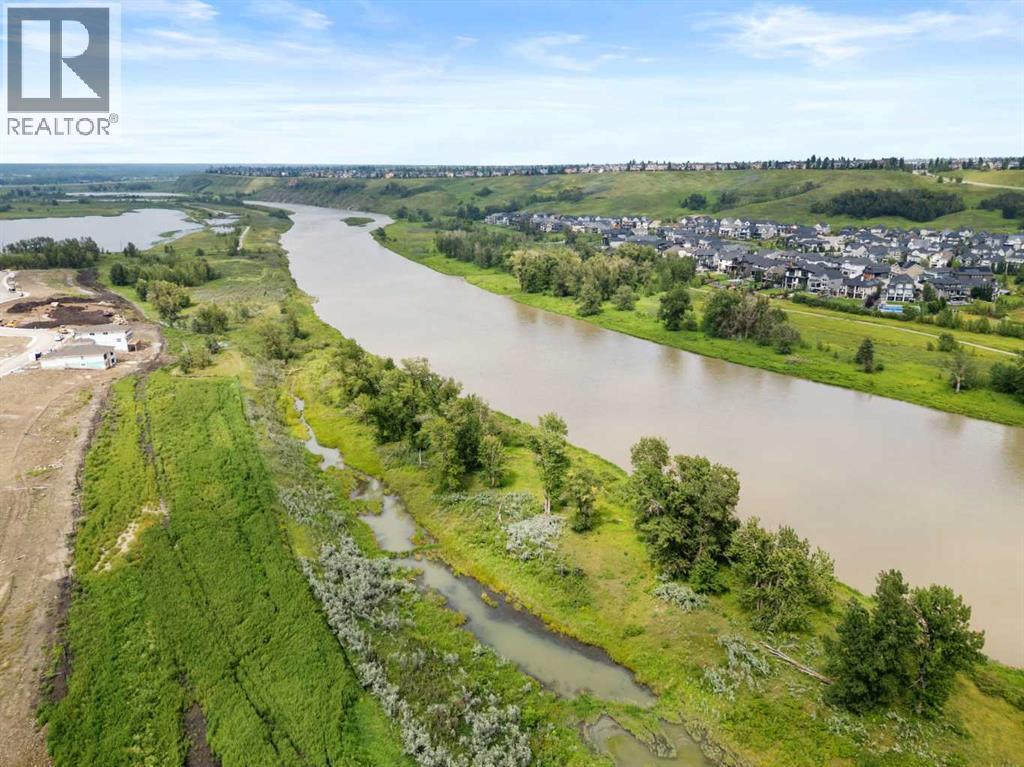 110 Wolf Creek Rise Se, Calgary, AB - Outdoor With Body Of Water With View