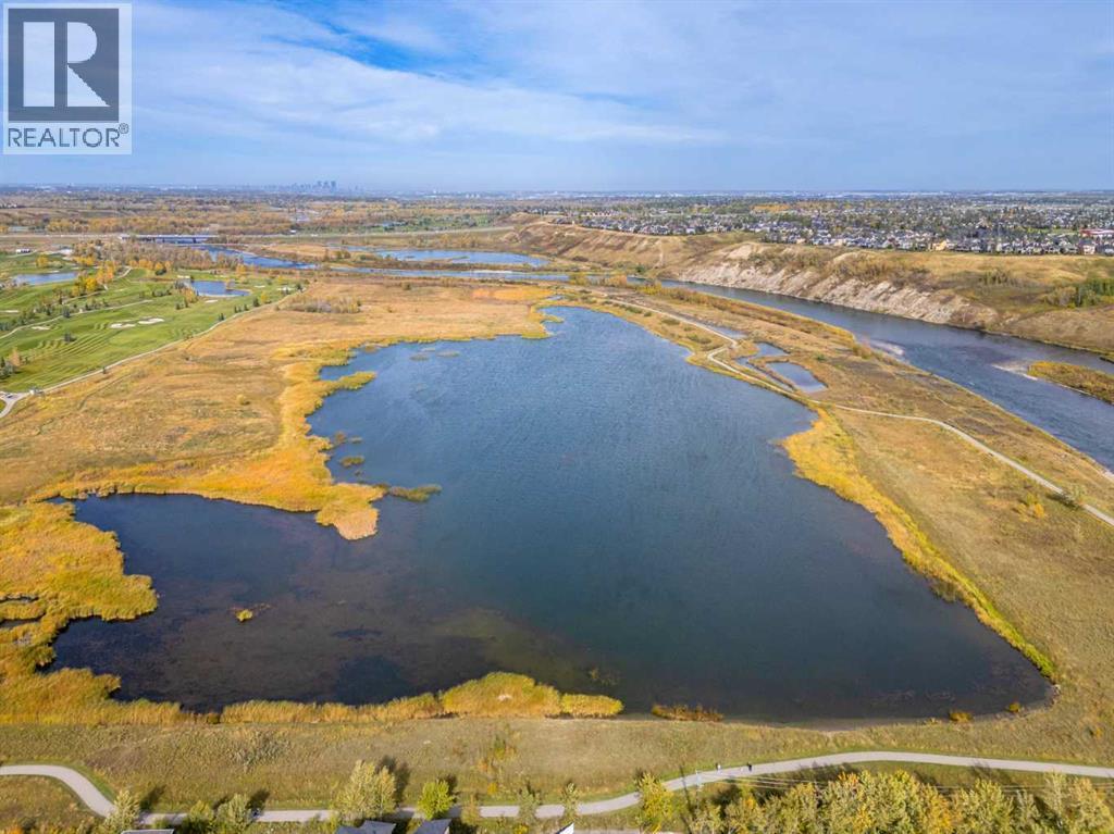 110 Wolf Creek Rise Se, Calgary, AB - Outdoor With Body Of Water With View