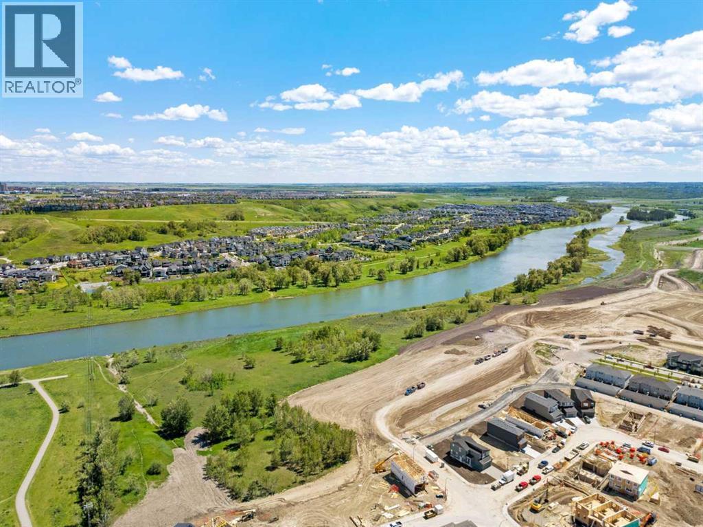 110 Wolf Creek Rise Se, Calgary, AB - Outdoor With Body Of Water With View