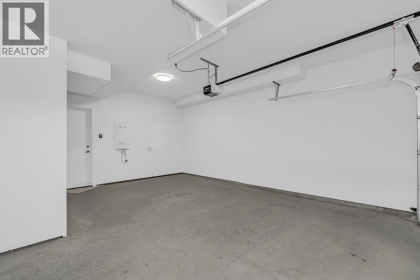 Photo of a similar home in the community. - 5300 Main Street Unit# 103, Kelowna, BC - Indoor Photo Showing Garage