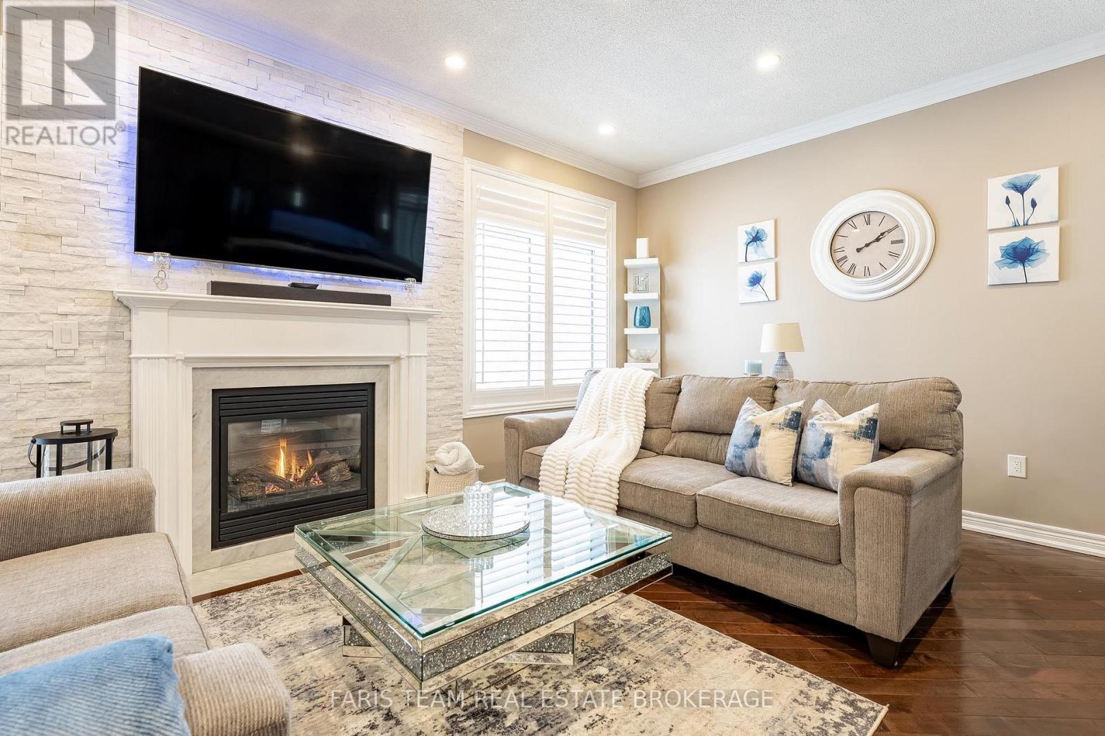 9 Broadpoint Street, Wasaga Beach, ON - Indoor Photo Showing Living Room With Fireplace