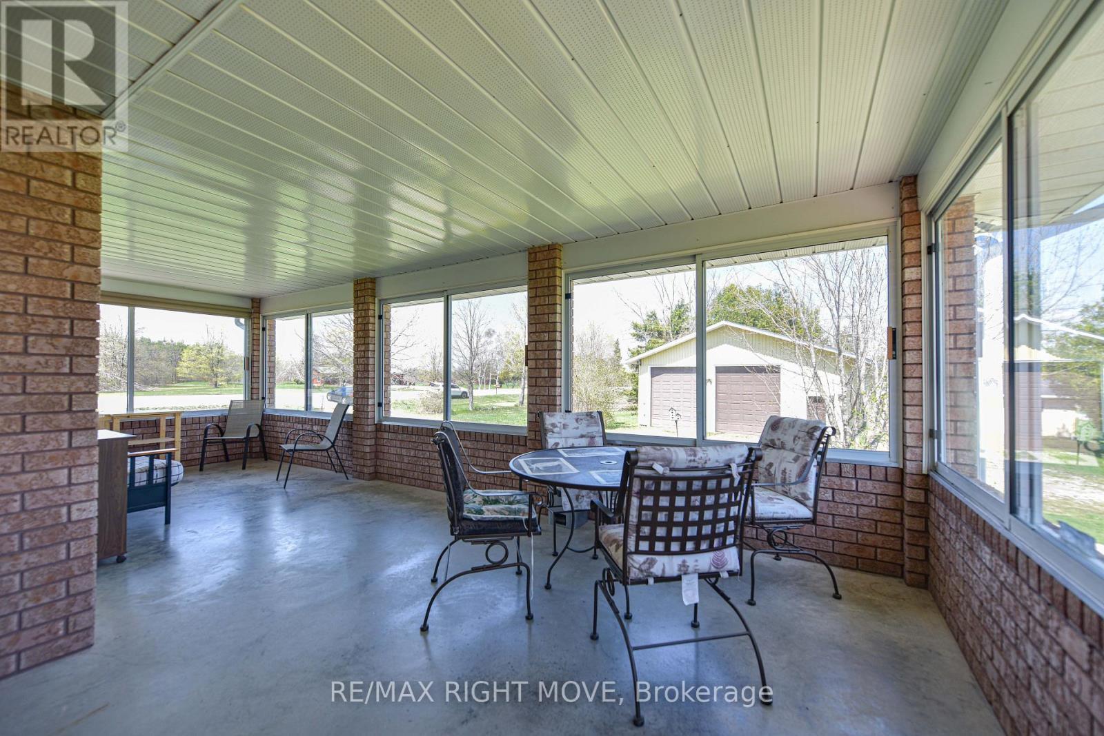 400 sq. ft. sunroom to enjoy morning coffee - 2723 Monck Road, Ramara, ON - Outdoor With Deck Patio Veranda With Exterior