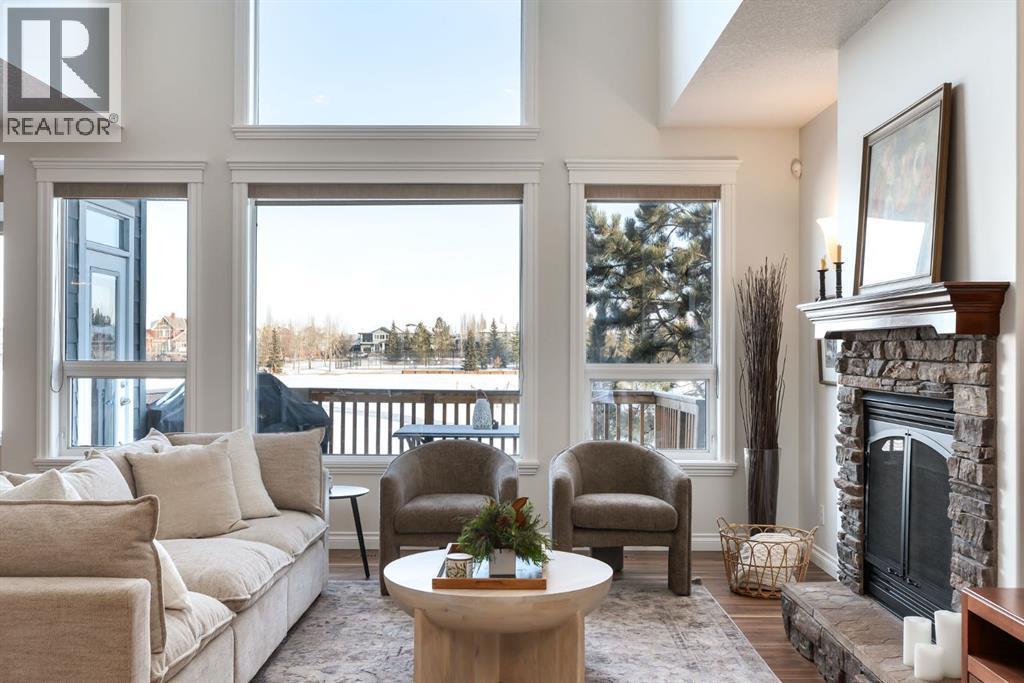 82 Auburn Sound Landing Se, Calgary, AB - Indoor Photo Showing Living Room With Fireplace