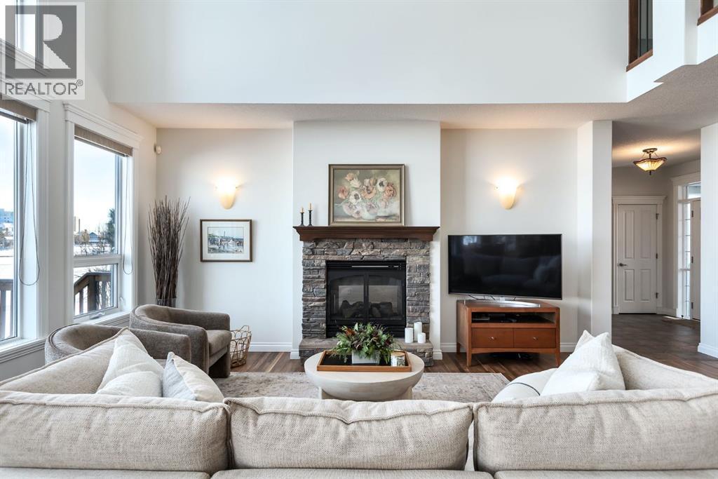 82 Auburn Sound Landing Se, Calgary, AB - Indoor Photo Showing Living Room With Fireplace