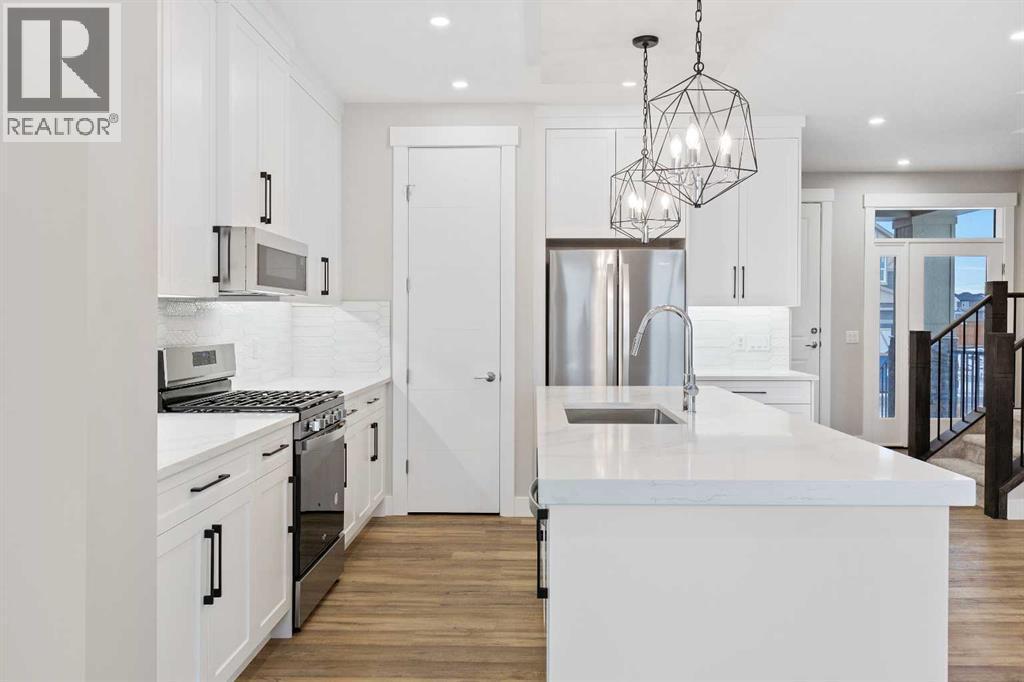 60 Bridges Drive, Langdon, AB - Indoor Photo Showing Kitchen With Upgraded Kitchen