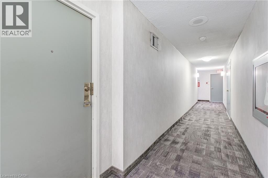 Hall featuring carpet floors and a textured ceiling - 3845 Lakeshore Boulevard W Unit# 804, Etobicoke, ON - Indoor Photo Showing Other Room