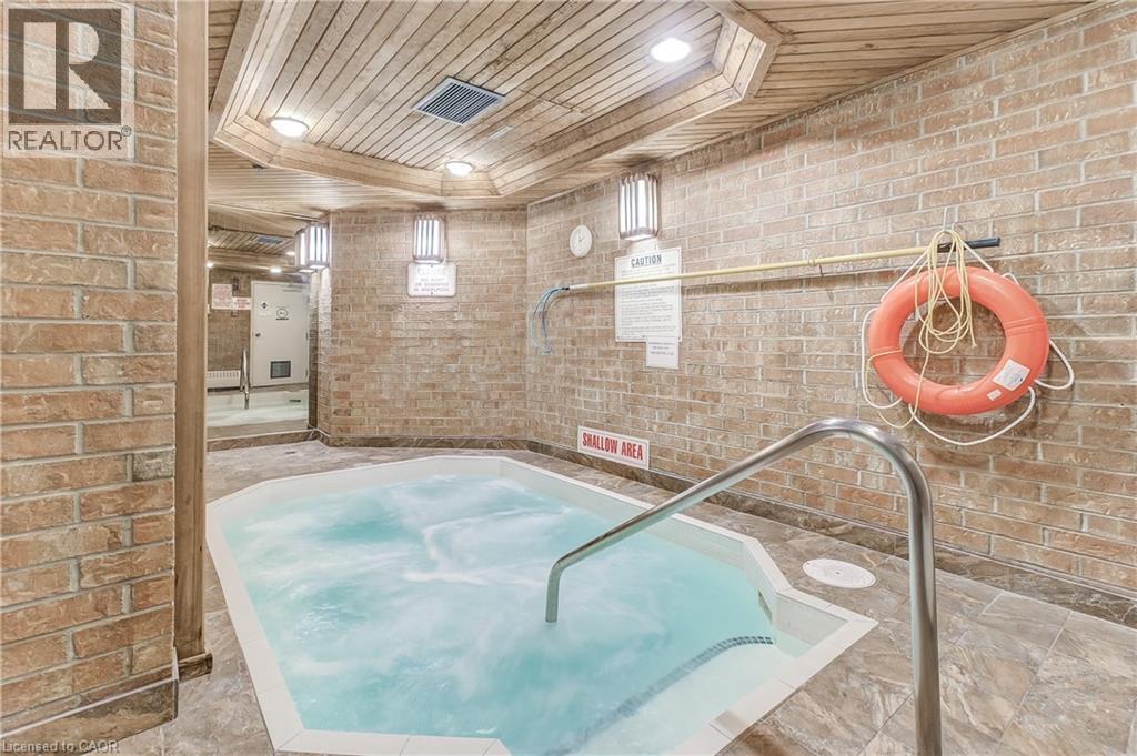 View of swimming pool with an in-ground hot tub - 3845 Lakeshore Boulevard W Unit# 804, Etobicoke, ON - Indoor Photo Showing Other Room