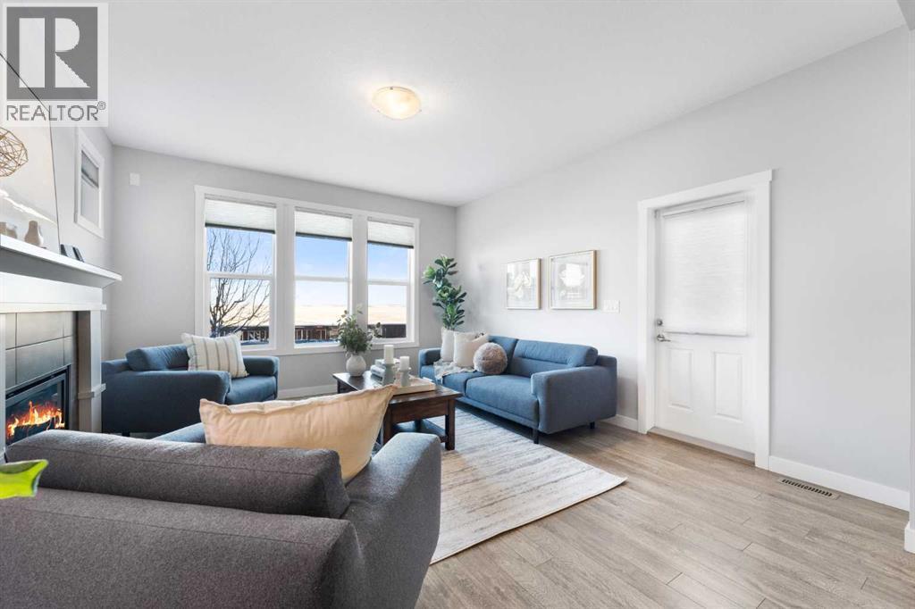 153 Williamstown Park Nw, Airdrie, AB - Indoor Photo Showing Living Room With Fireplace