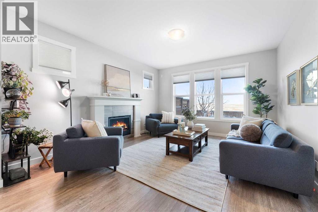 153 Williamstown Park Nw, Airdrie, AB - Indoor Photo Showing Living Room With Fireplace
