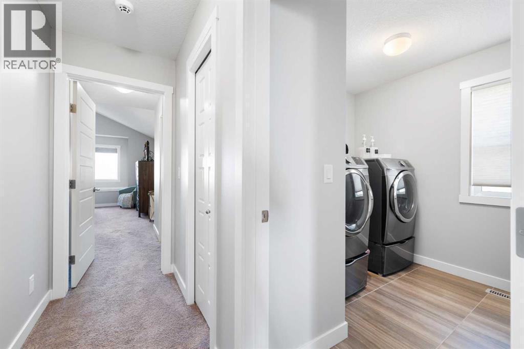 153 Williamstown Park Nw, Airdrie, AB - Indoor Photo Showing Laundry Room