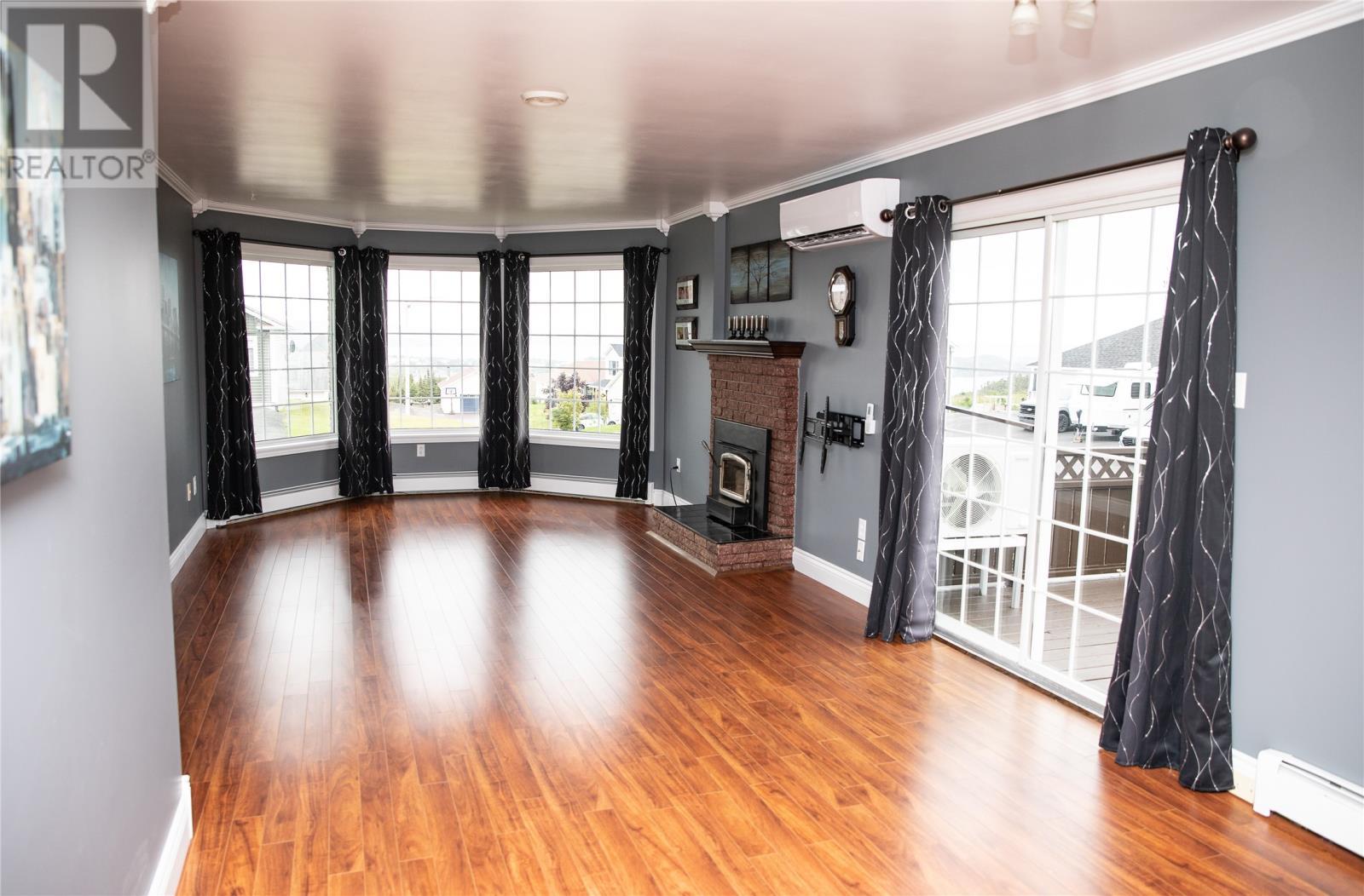 26 Woody Island Drive, Arnold’S Cove, NL - Indoor Photo Showing Other Room With Fireplace