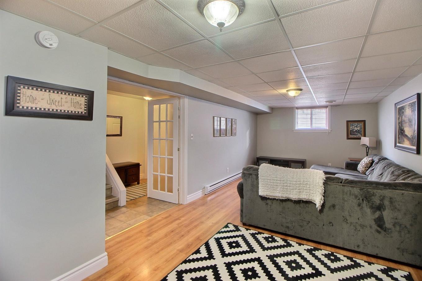 Family room - 21 Rue Boutin, Amos, QC - Indoor Photo Showing Basement