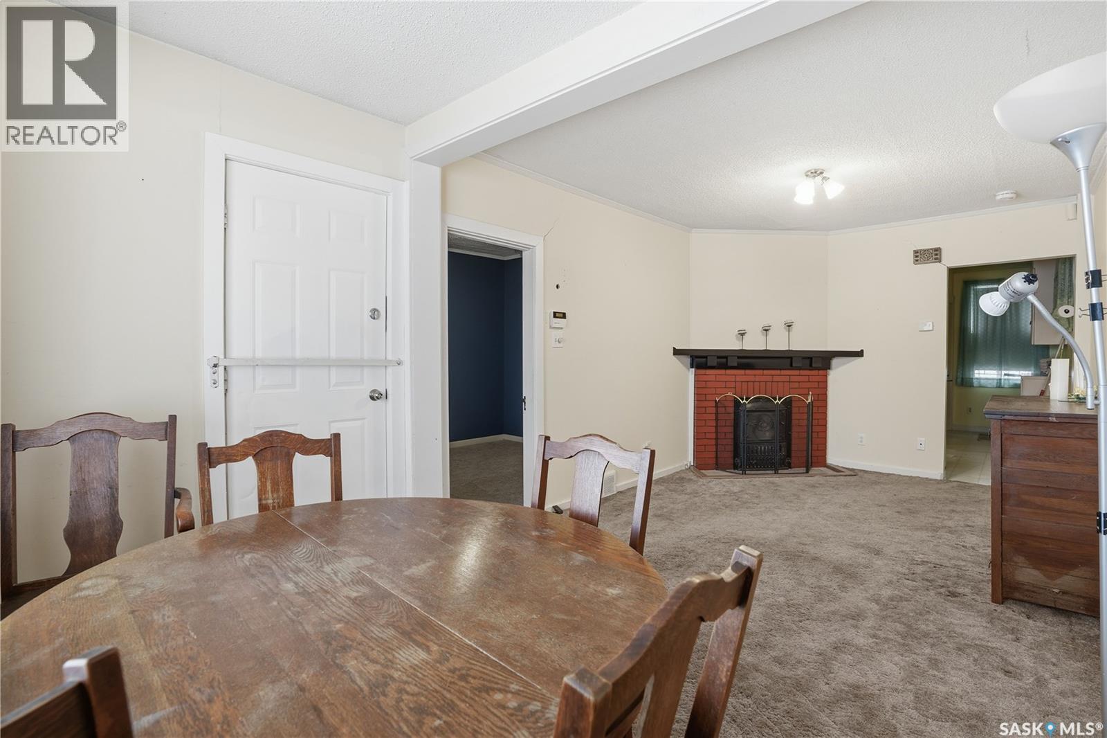 1452 Princess Street, Regina, SK - Indoor Photo Showing Dining Room With Fireplace