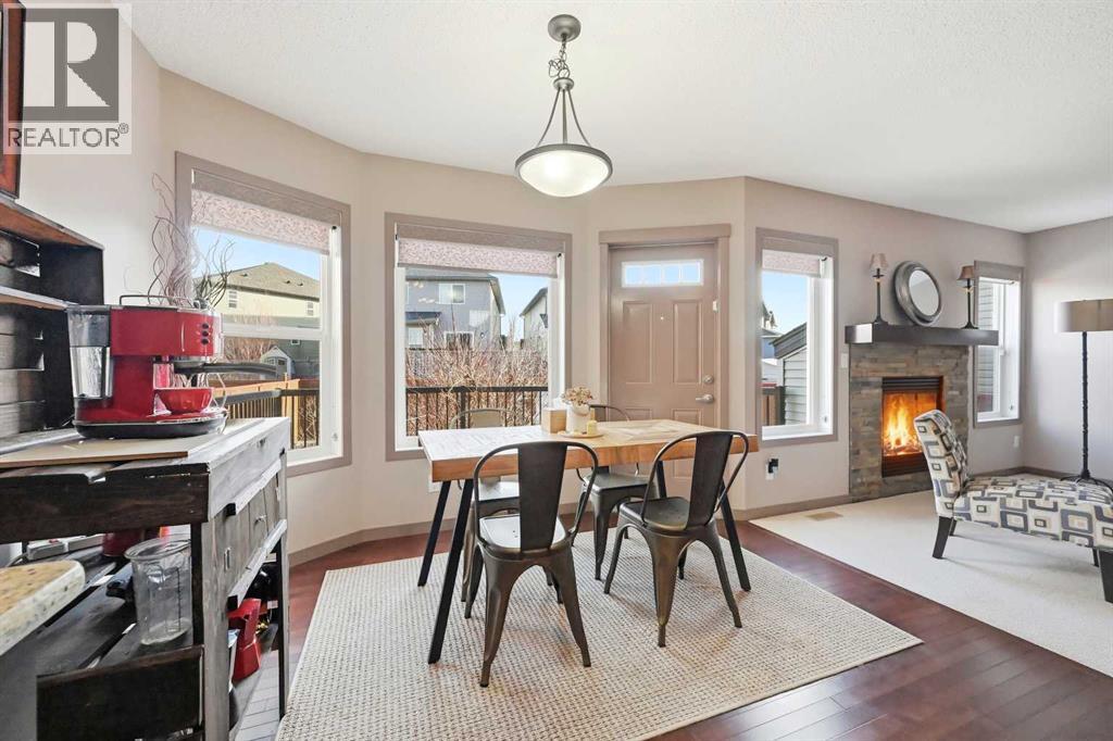 28 Skyview Shores Terrace Ne, Calgary, AB - Indoor Photo Showing Dining Room With Fireplace