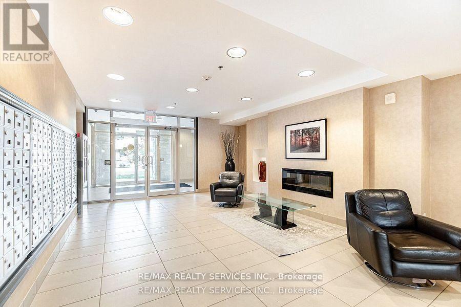 112 - 5317 Upper Middle Road, Burlington, ON - Indoor Photo Showing Other Room With Fireplace