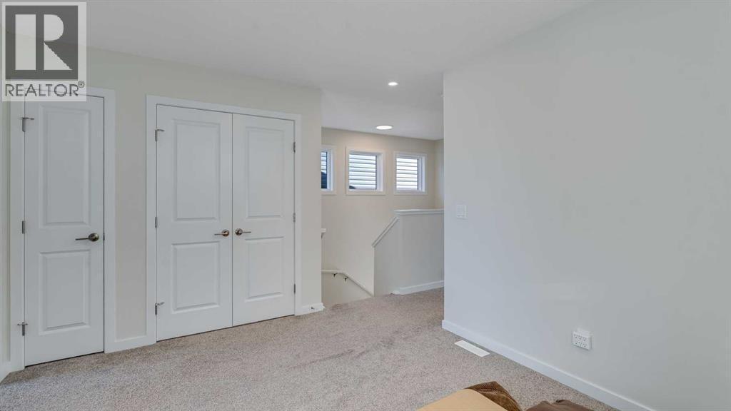 18 Amblehurst Path Nw, Calgary, AB - Indoor Photo Showing Other Room