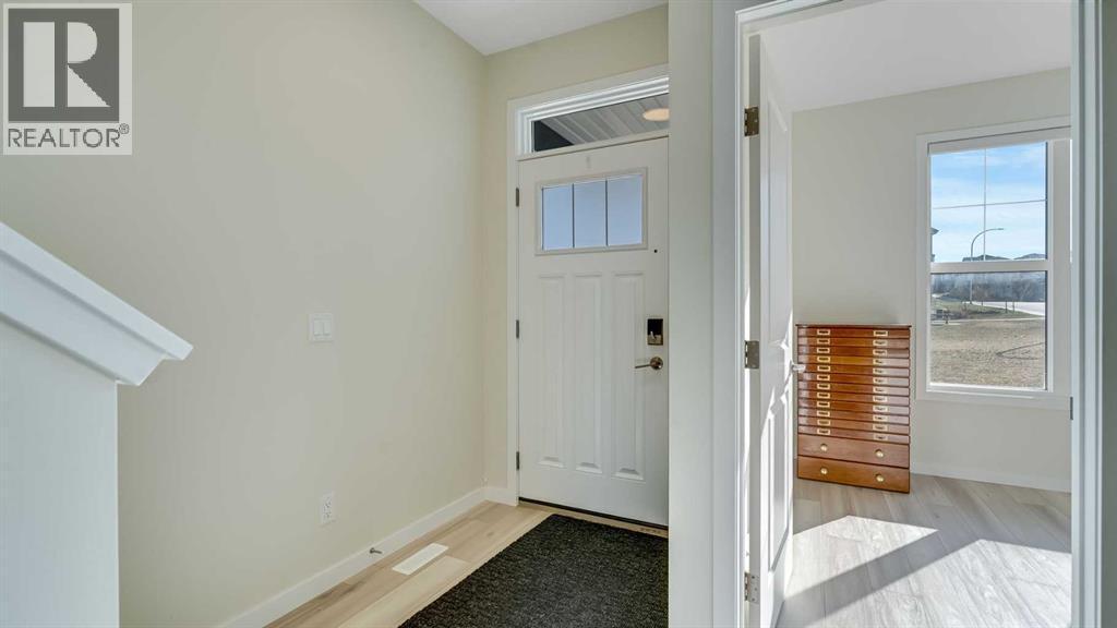18 Amblehurst Path Nw, Calgary, AB - Indoor Photo Showing Other Room