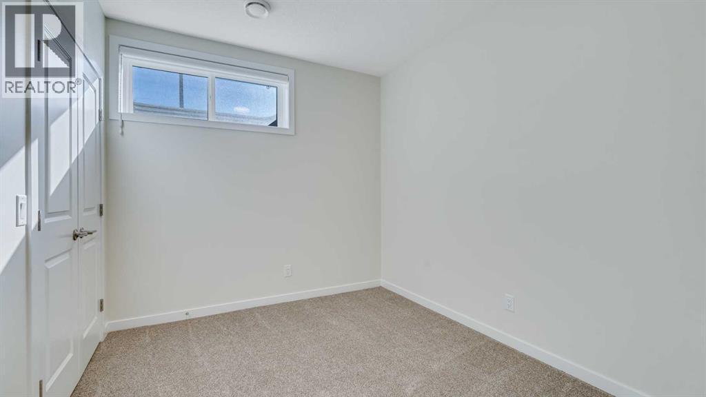 18 Amblehurst Path Nw, Calgary, AB - Indoor Photo Showing Other Room