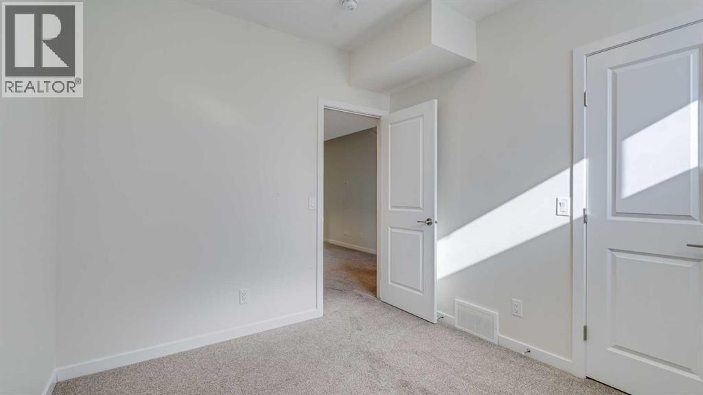 18 Amblehurst Path Nw, Calgary, AB - Indoor Photo Showing Other Room