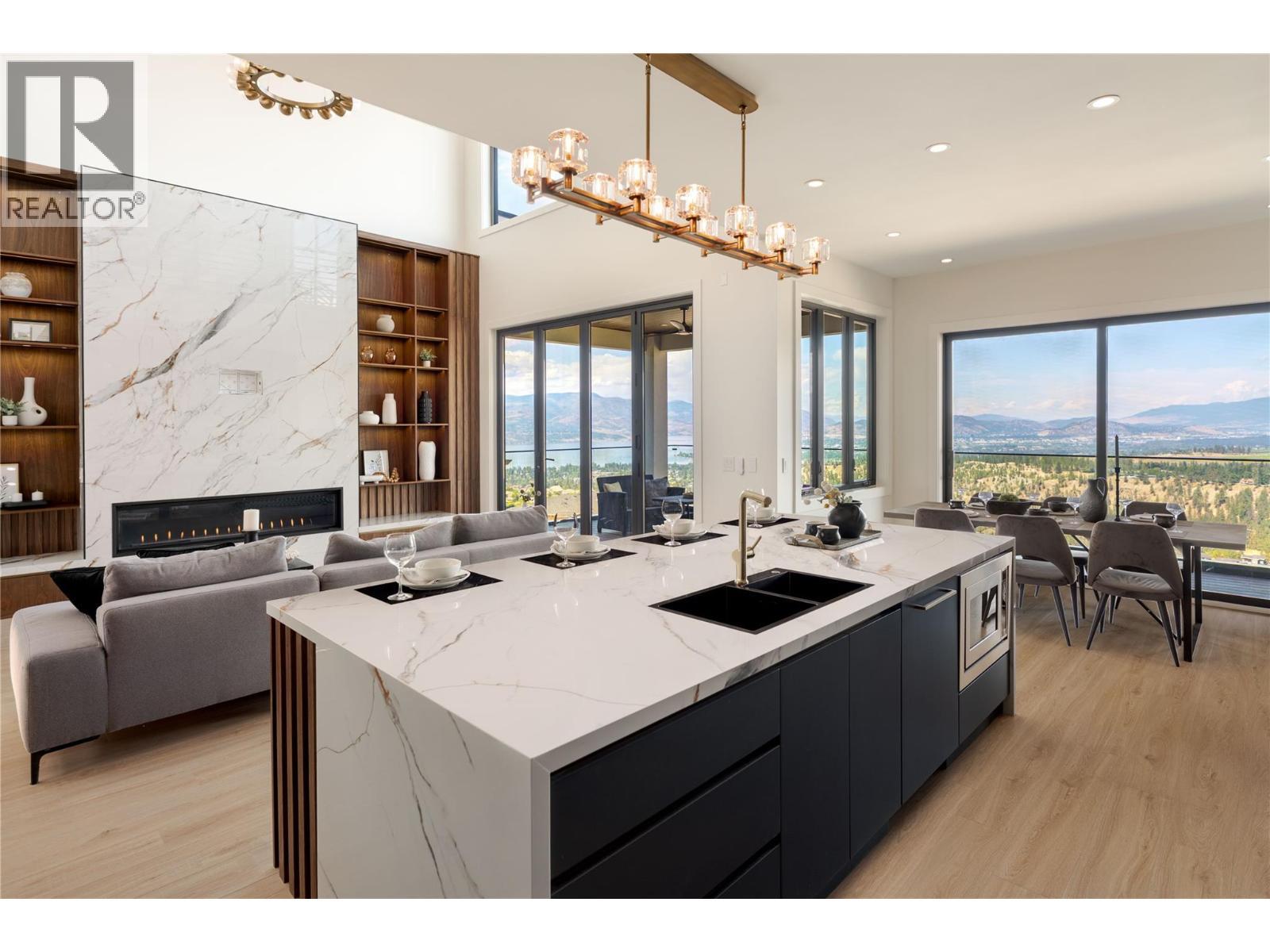 1016 Emslie Street, Kelowna, BC - Indoor Photo Showing Kitchen With Fireplace With Double Sink