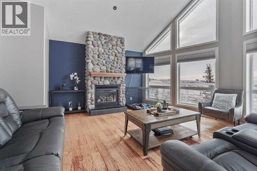 95048 River Ridge Road, Rural Lethbridge County, AB - Indoor Photo Showing Living Room With Fireplace
