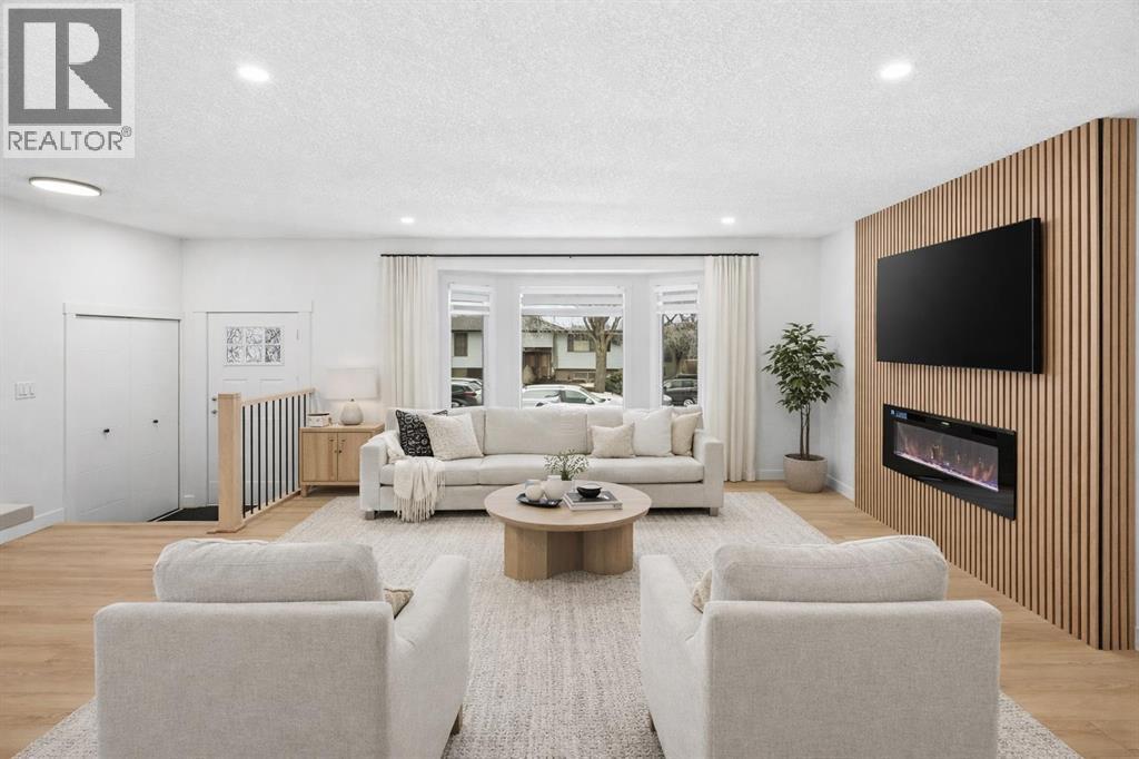 2404 51 Street Ne, Calgary, AB - Indoor Photo Showing Living Room With Fireplace