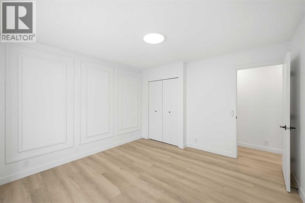 Primary bedroom - 2404 51 Street Ne, Calgary, AB - Indoor Photo Showing Other Room