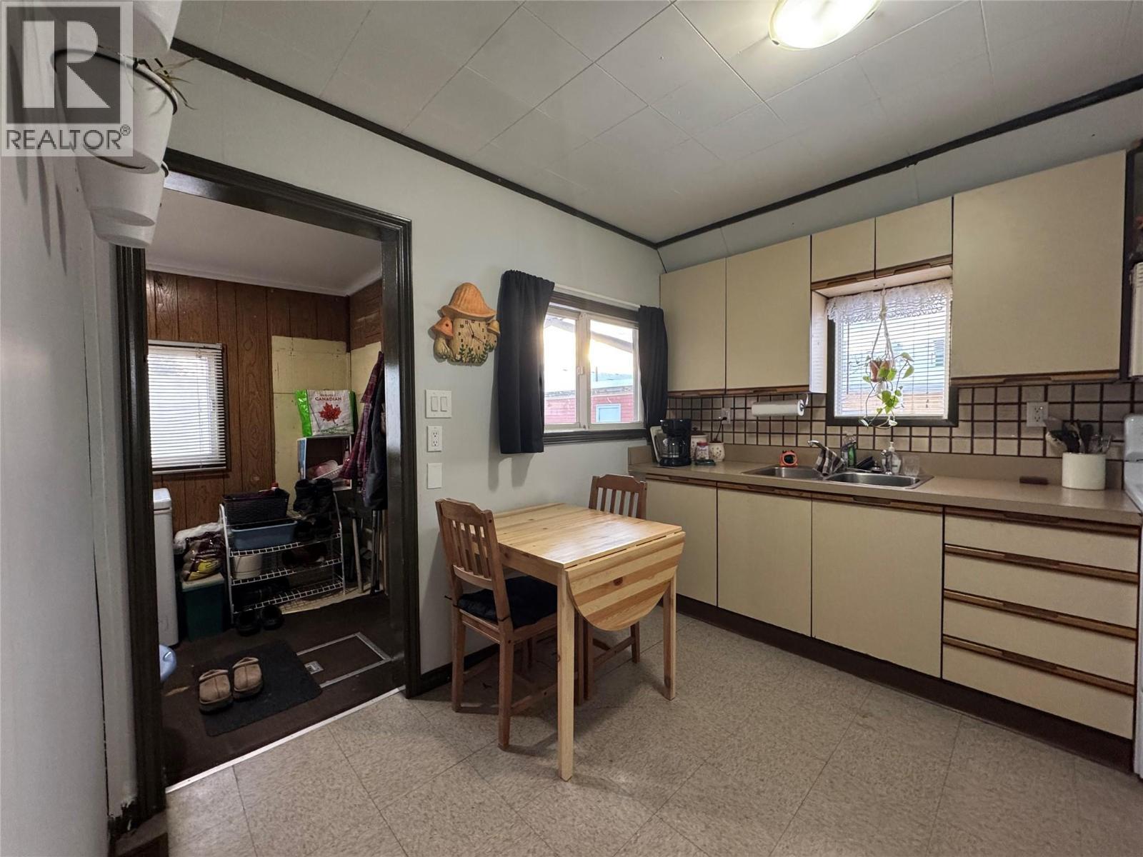 5007 Sukrit Parmar Lane, Pouce Coupe, BC - Indoor Photo Showing Kitchen With Double Sink