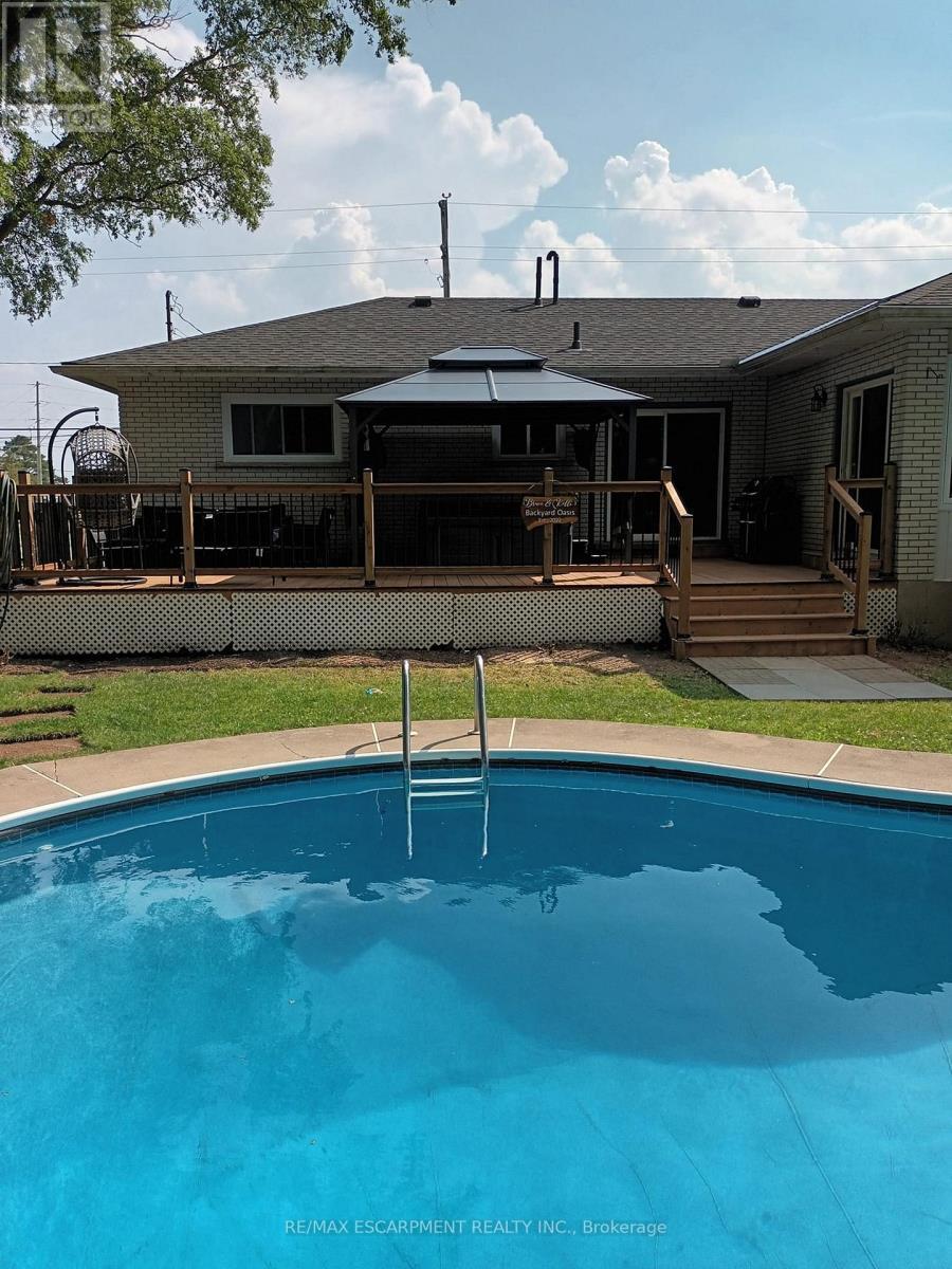 111 King Street E, Haldimand, ON - Outdoor With In Ground Pool With Deck Patio Veranda