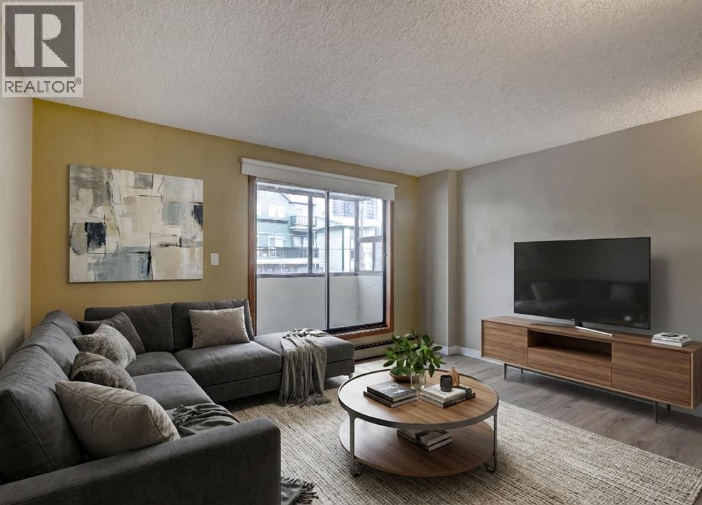 207, 111 14 Avenue Se, Calgary, AB - Indoor Photo Showing Living Room