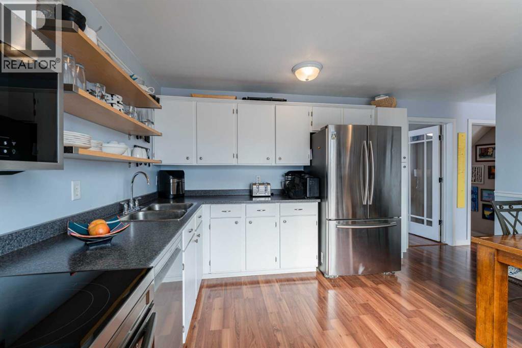 127 Shawmeadows Close Sw, Calgary, AB - Indoor Photo Showing Kitchen With Stainless Steel Kitchen With Double Sink