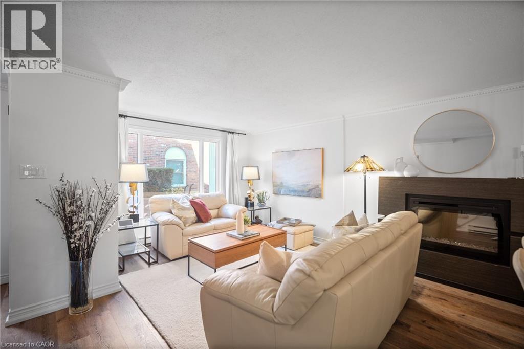 2058 Brant Street Unit# 3, Burlington, ON - Indoor Photo Showing Living Room With Fireplace