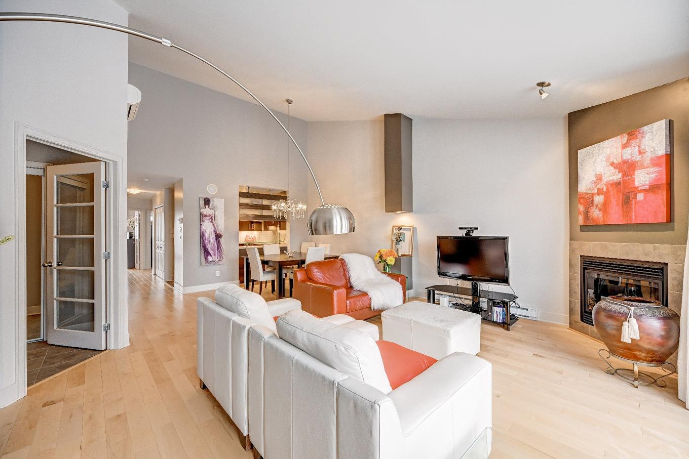 Overall view - 402-651 Rue Jacques-Lavigne, Sainte-Thérèse, QC - Indoor Photo Showing Living Room With Fireplace